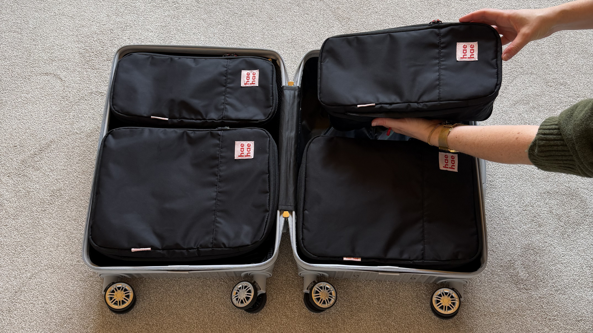 Compression packing cubes organised inside a carry-on suitcase