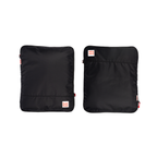 Two black compression packing cubes with a brand logo on a white background