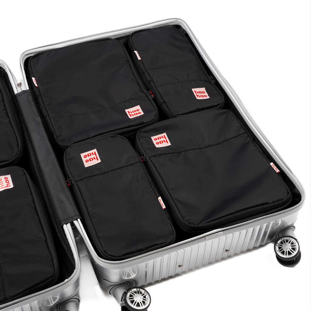 hae hae Ink compression packing cubes packed inside a large hold suitcase, 4 pack