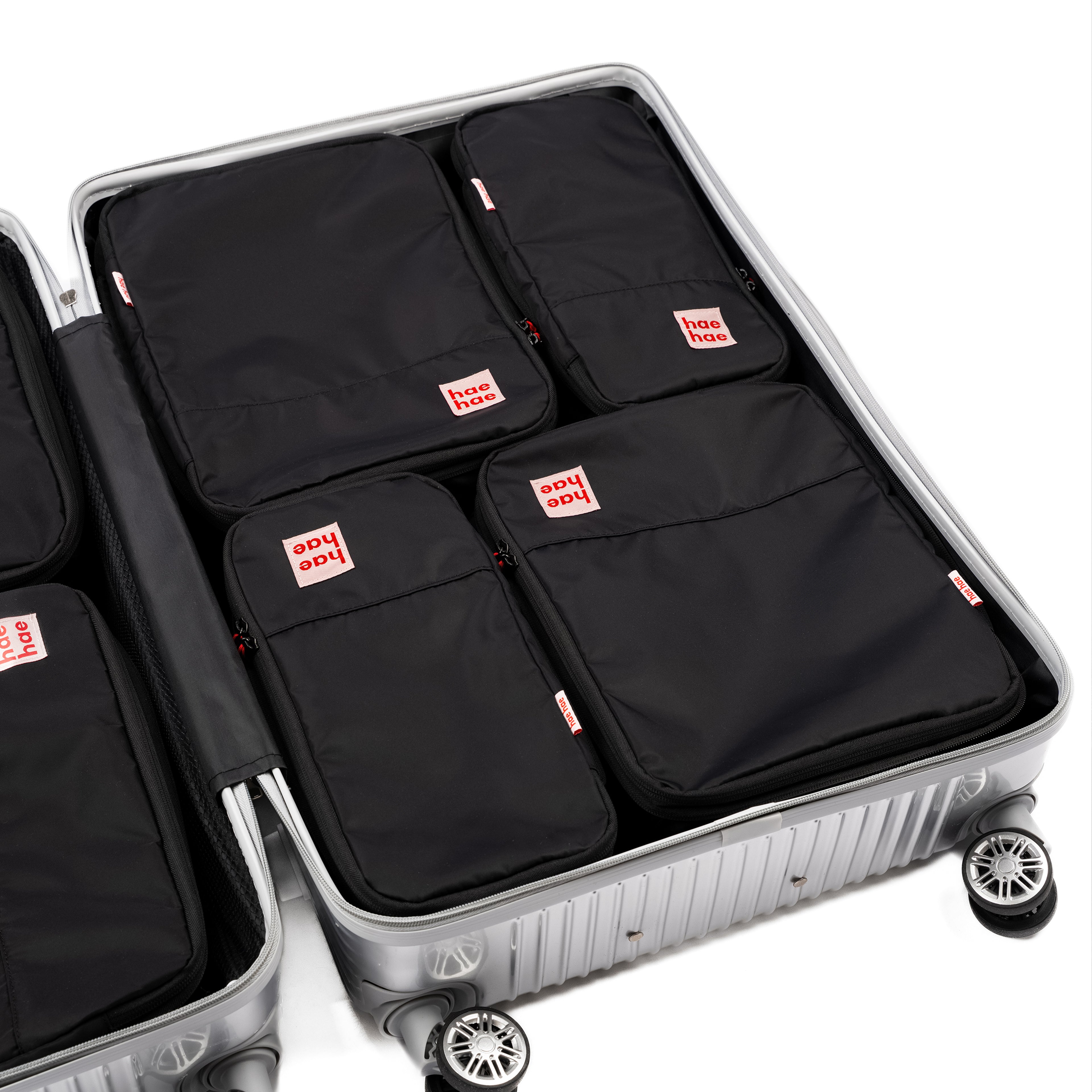 hae hae Ink compression packing cubes packed inside a large hold suitcase, 4 pack