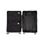 Two large compression packing cubes in silver open suitcase on a white background