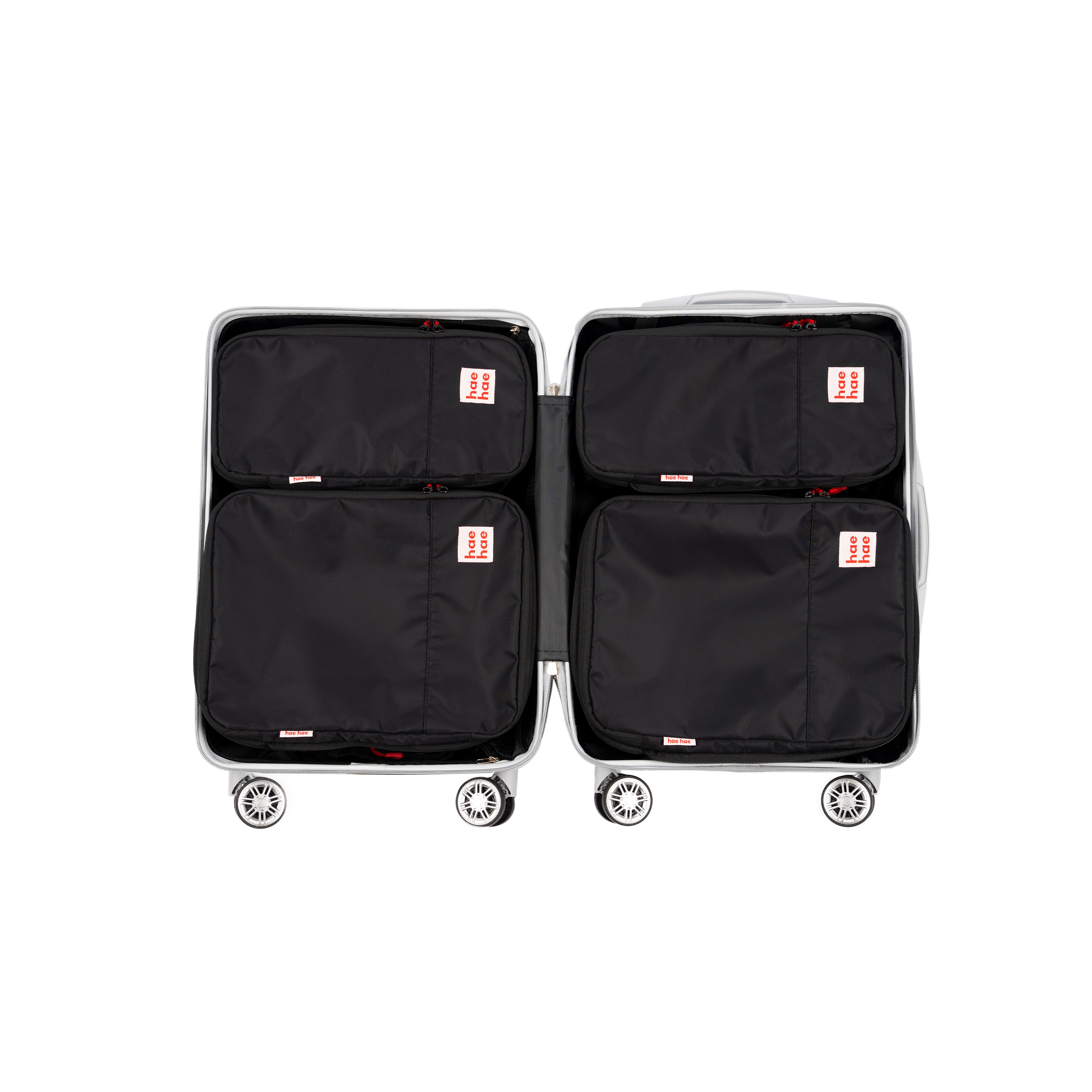 hae hae Ink compression packing cubes packed inside a cabin suitcase, 4 pack