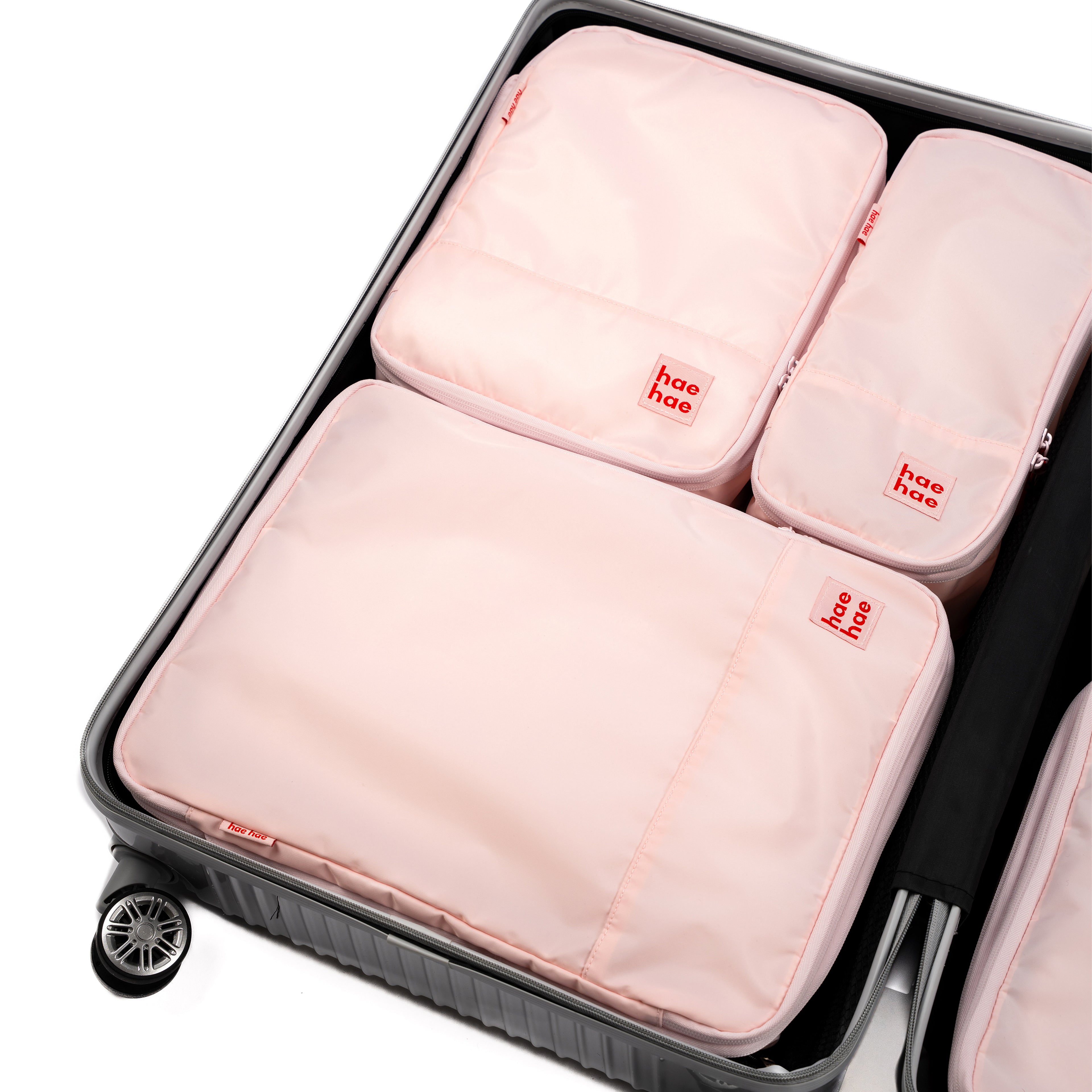hae hae Blossom compression packing cubes packed inside a cabin suitcase, 6 pack