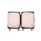 Two hae hae compression packing cubes within a carry on case