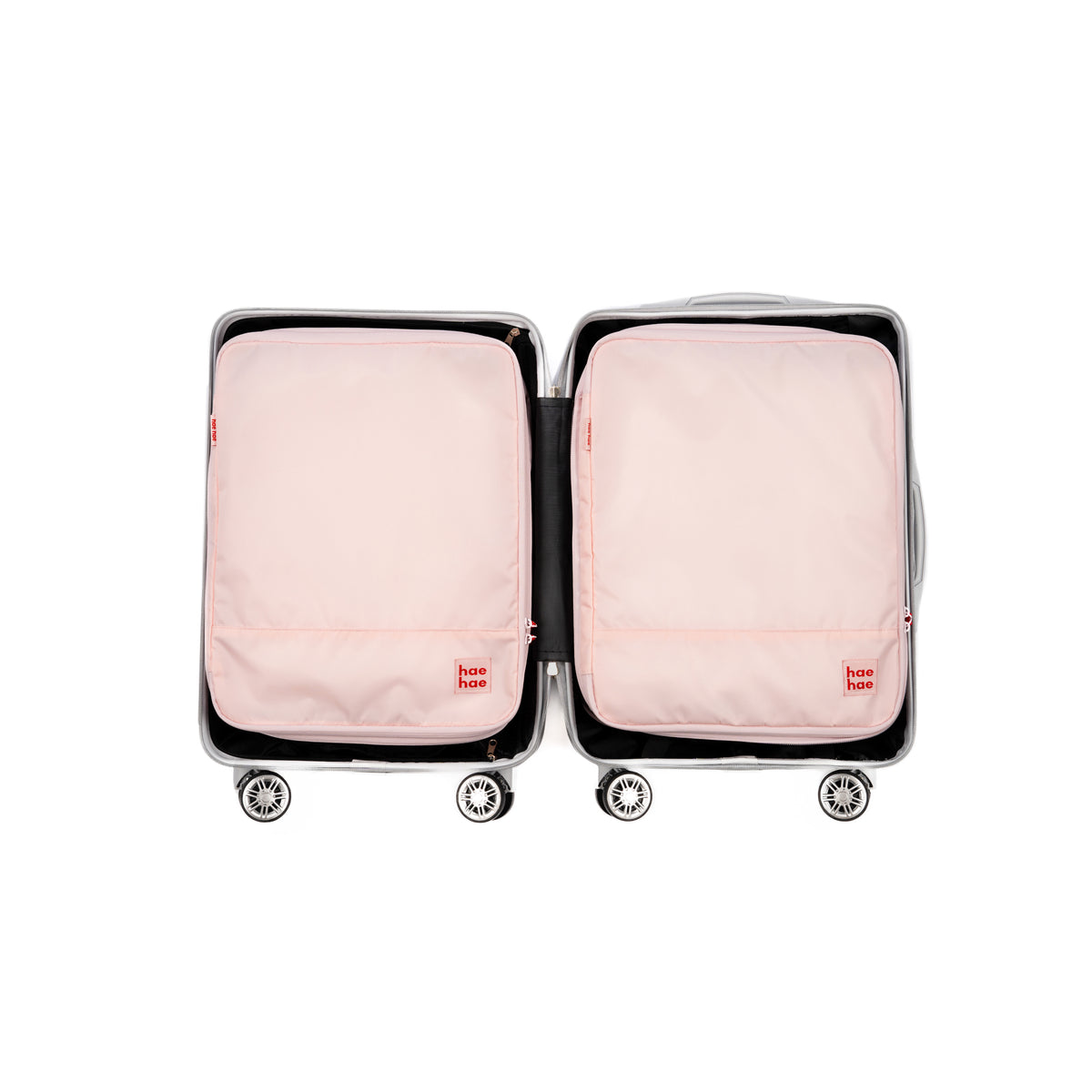 Two hae hae compression packing cubes within a carry on case