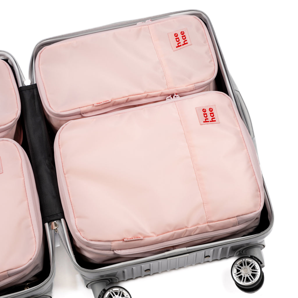 hae hae Blossom compression packing cubes packed inside a cabin suitcase, 4 pack